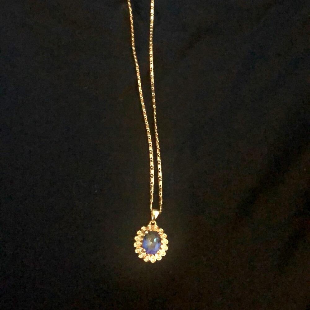 Gold plated costume necklace. 18” long chain with blue stone pendant